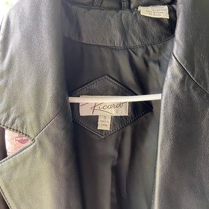 Woman’s small soft leather jacket with scarf by Harley.